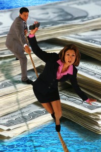 Businesswomen Balancing Over Money
